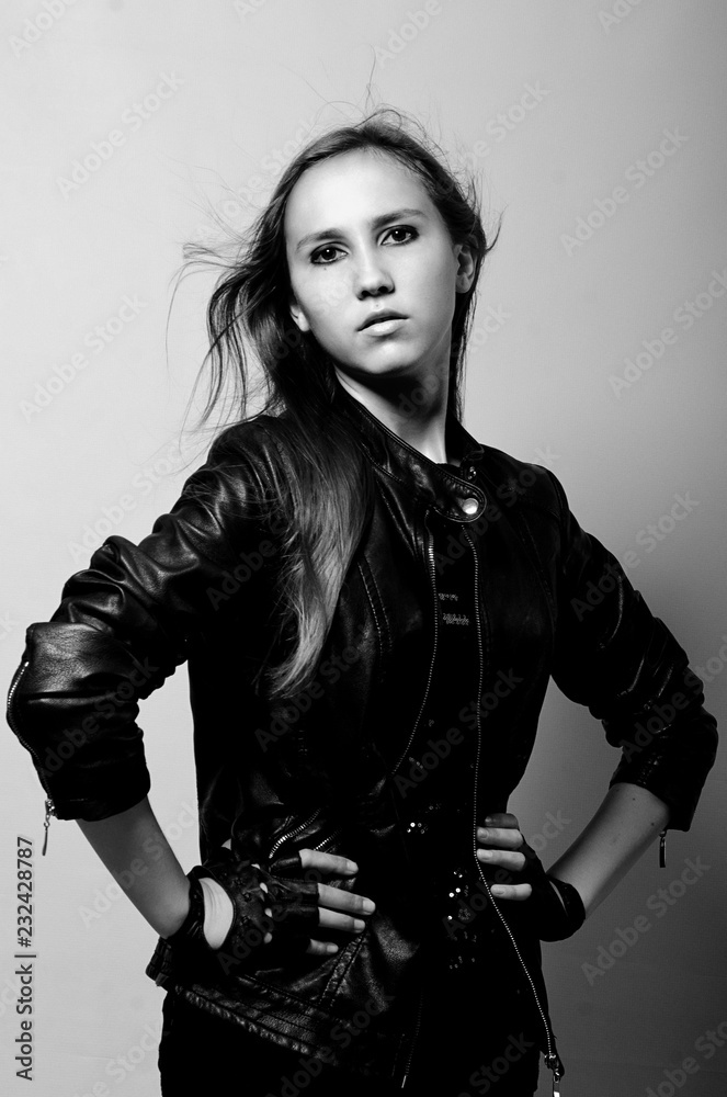 Naklejka premium beautiful girl in leather jacket