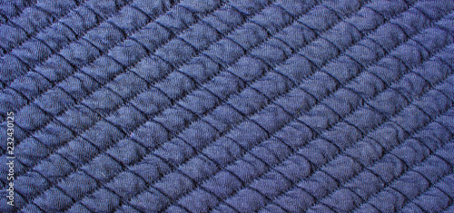 Blue knitted quilted background