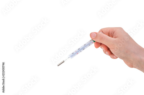 Hand of woman is holding mercury thermometer
