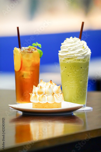 Sweet and beverate; Ice lemen tea and ice milk green tea with crown pie cake photo
