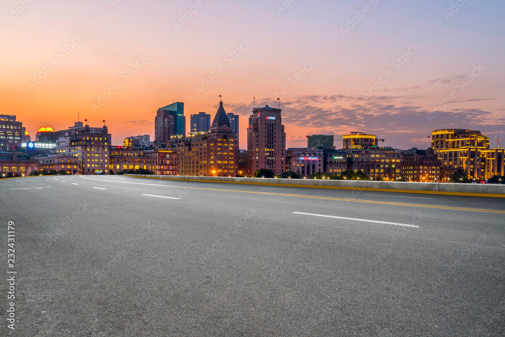 City skyscrapers and road asphalt pavement City skyscrapers and road asphalt pavement