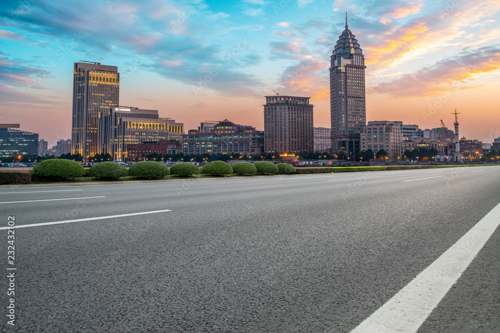 Naklejka premium City skyscrapers and road asphalt pavement