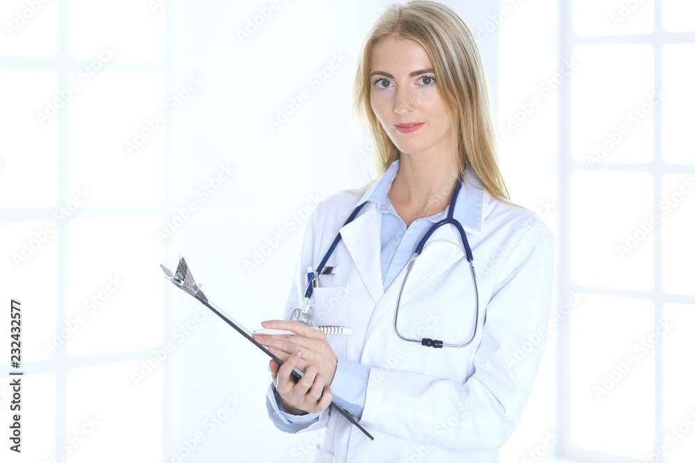 Doctor woman at work. Portrait of female physician. Medicine and healthcare concept Doctor woman at work. Portrait of female physician. Medicine and healthcare concept