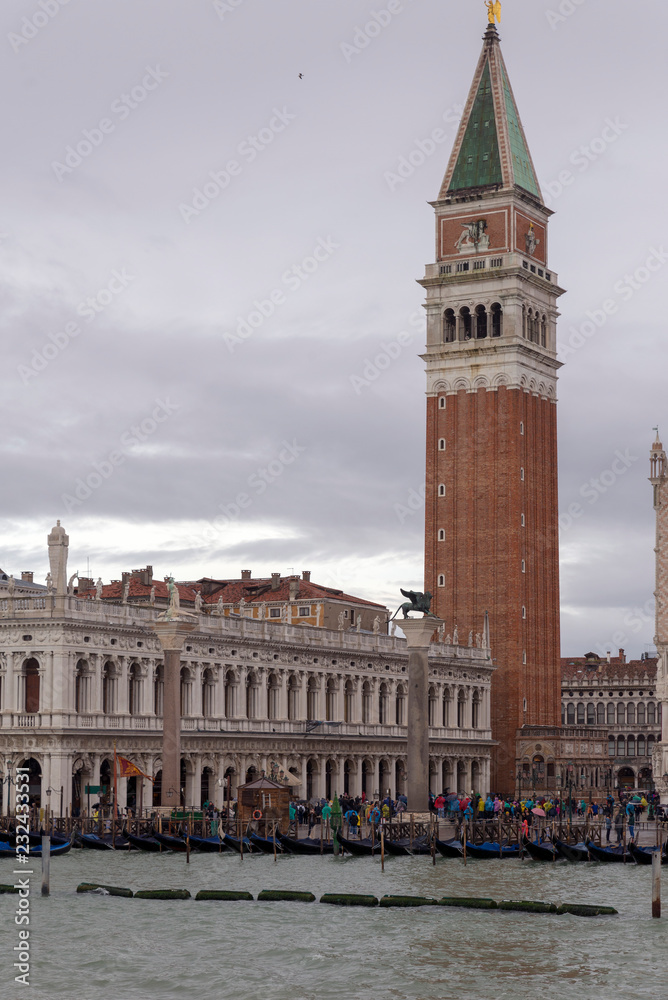 VENICE, ITALY- OCTOBER 30, 2018: St Mark's Campanile is the bell tower of St Mark's Basilica in Venice San Marco. It is one of the most recognizable symbols of the city. view from the sea