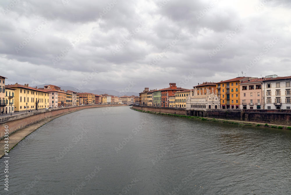PISA, ITALY - OCTOBER 29, 2018: View of the medieval town of Pisa from bridge 