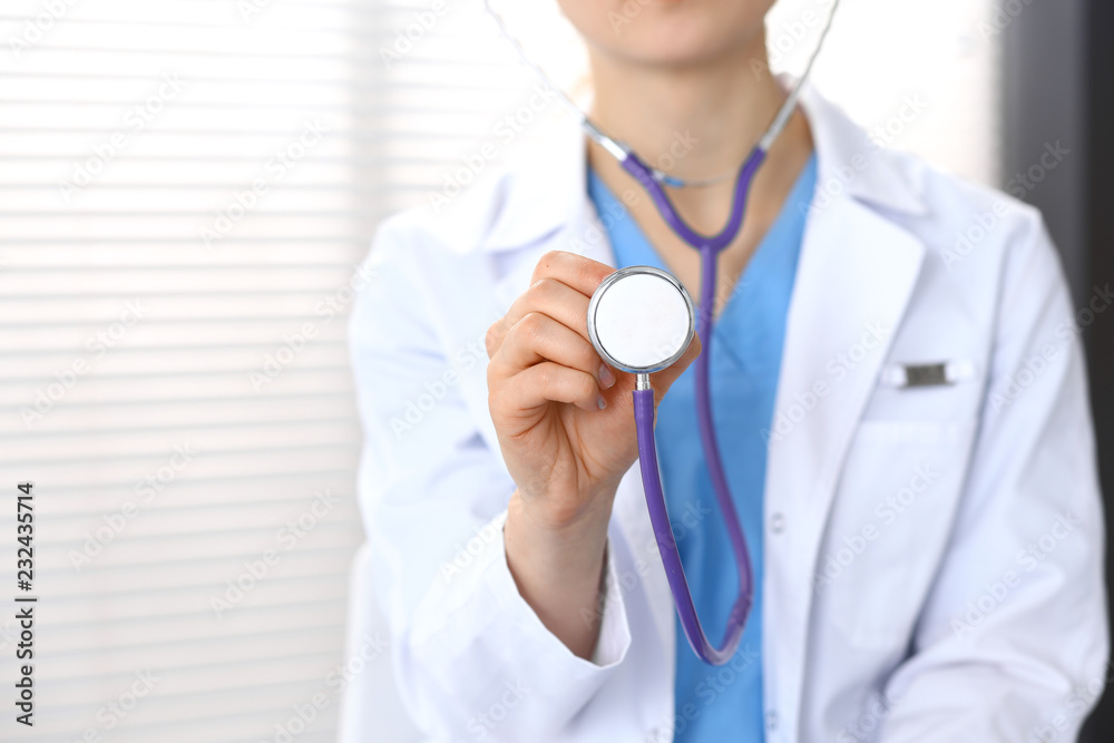 Doctor holds stethoscope head, closeup. Physician ready to examine and help patient. Medical help and insurance in health care, best treatment and medicine concept Doctor holds stethoscope head, closeup. Physician ready to examine and help patient. Medical help and insurance in health care, best treatment and medicine concept