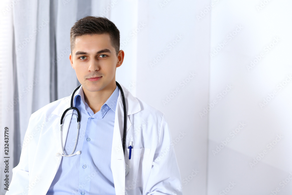 Doctor man filling up medical form at clipboard. Healthcare, insurance in medicine and patient service concept Doctor man filling up medical form at clipboard. Healthcare, insurance in medicine and patient service concept