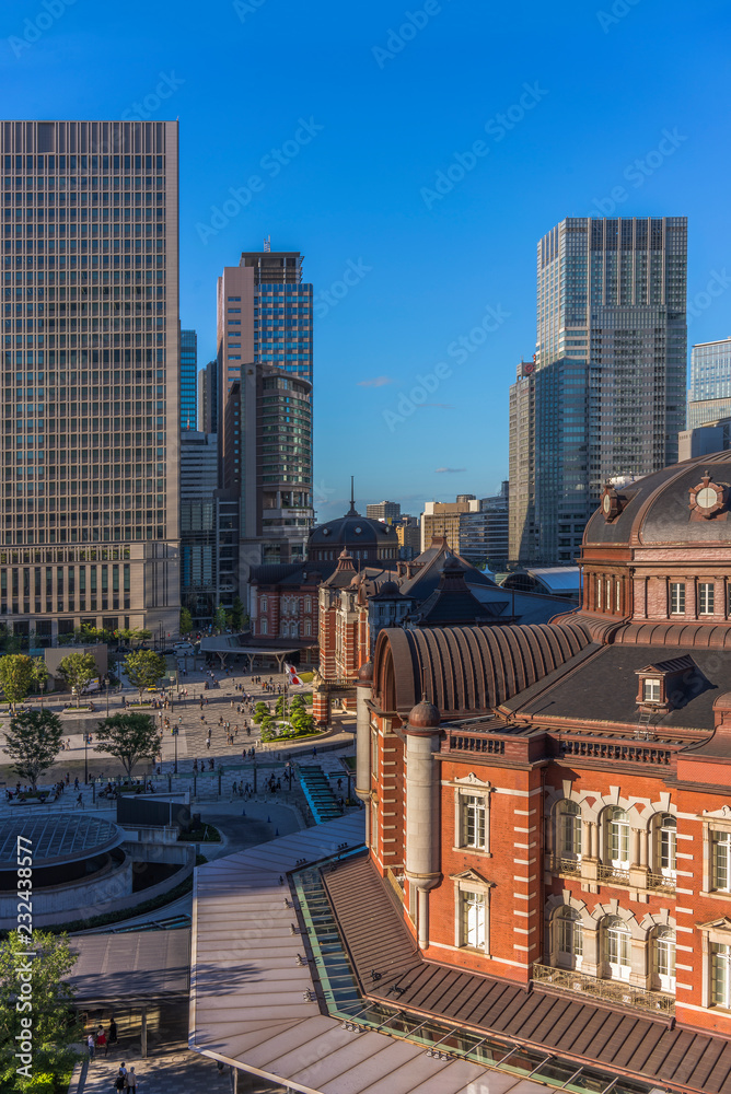 View of Marunouchi side of Tokyo railway station in the Chiyoda City, Tokyo, Japan.  The station is divided into Marunouchi and Yaesu sides in its directional signage.