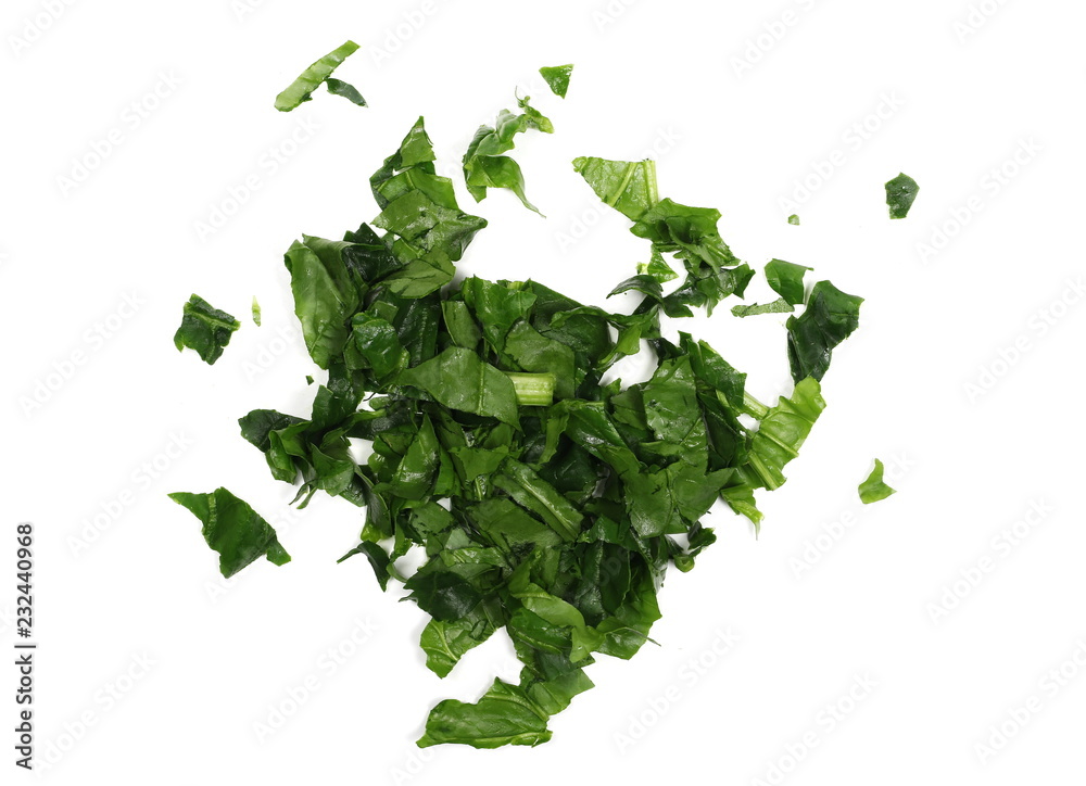 Fresh sliced, cut up spinach leaves isolated on white background, top view Fresh sliced, cut up spinach leaves isolated on white background, top view