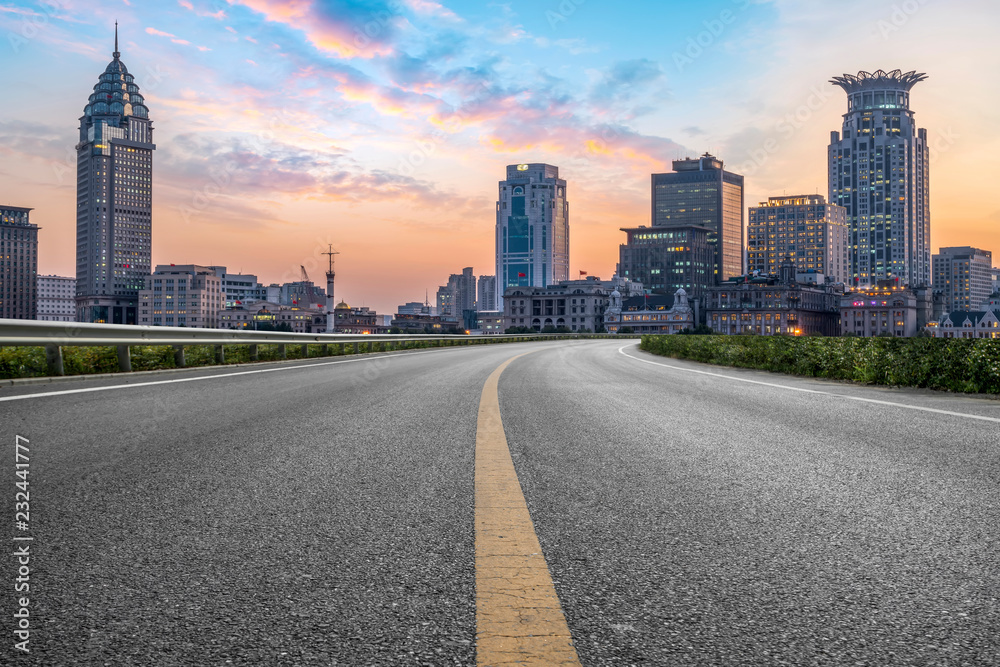 City skyscrapers and road asphalt pavement City skyscrapers and road asphalt pavement