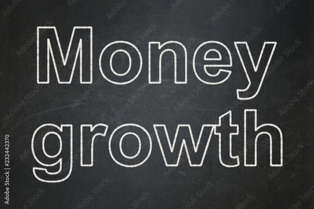 Banking concept: text Money Growth on Black chalkboard background Banking concept: text Money Growth on Black chalkboard background