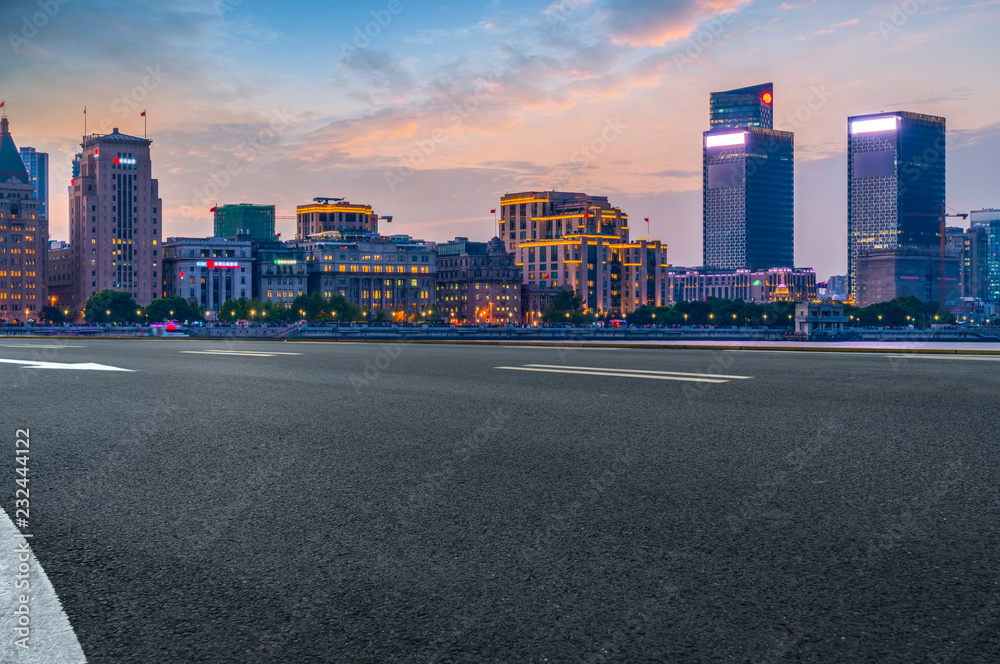 City skyscrapers and road asphalt pavement City skyscrapers and road asphalt pavement