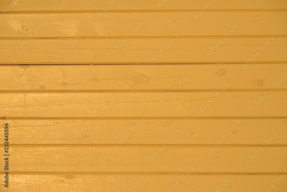 Fototapeta premium Yellow painted wooden house wall of timber 