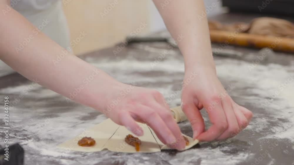 Closeup of pastry chef making croissants with pastry dough Closeup of pastry chef making croissants with pastry dough
