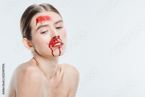 Obraz na płótnie female victim of domestic violence with blood on face isolated on white