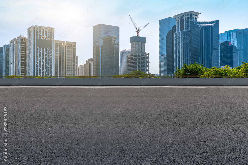 City skyscrapers and road asphalt pavement