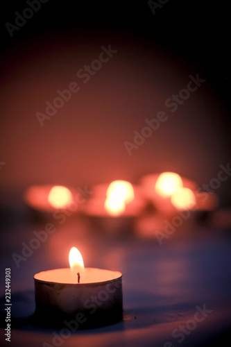 Burning Candles with Bokeh Light on a Black Background