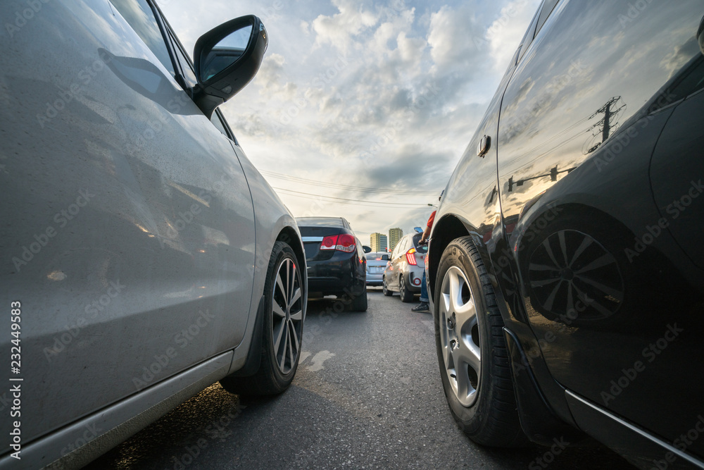 Cars on city street in traffic jam at rush hour