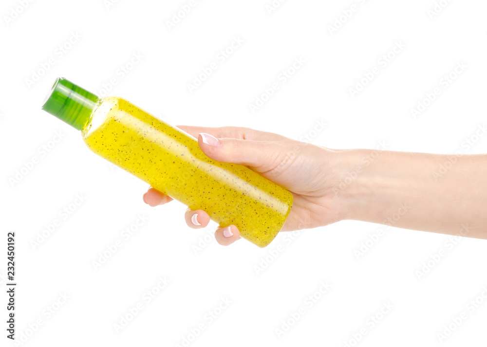 Bottle body scrub in hand beauty body care on a white background. Isolation