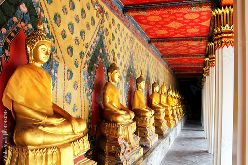 Row of Golden Buddha in Thailand, Bangkok, Thailand photo