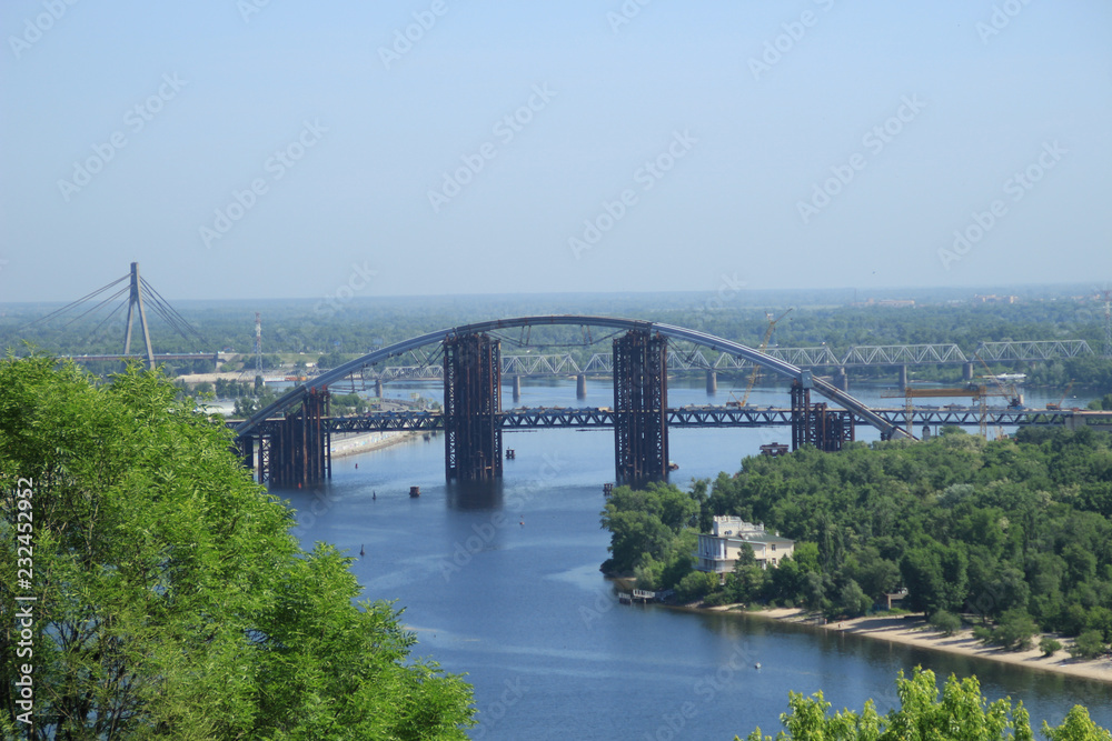 View of the Dnipro River from the park. Kiev. Ukraine. Traveling Bridge to the city