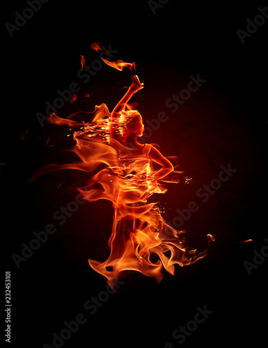 Fiery flamenco dancer. Fire flames on black background. © -Misha
