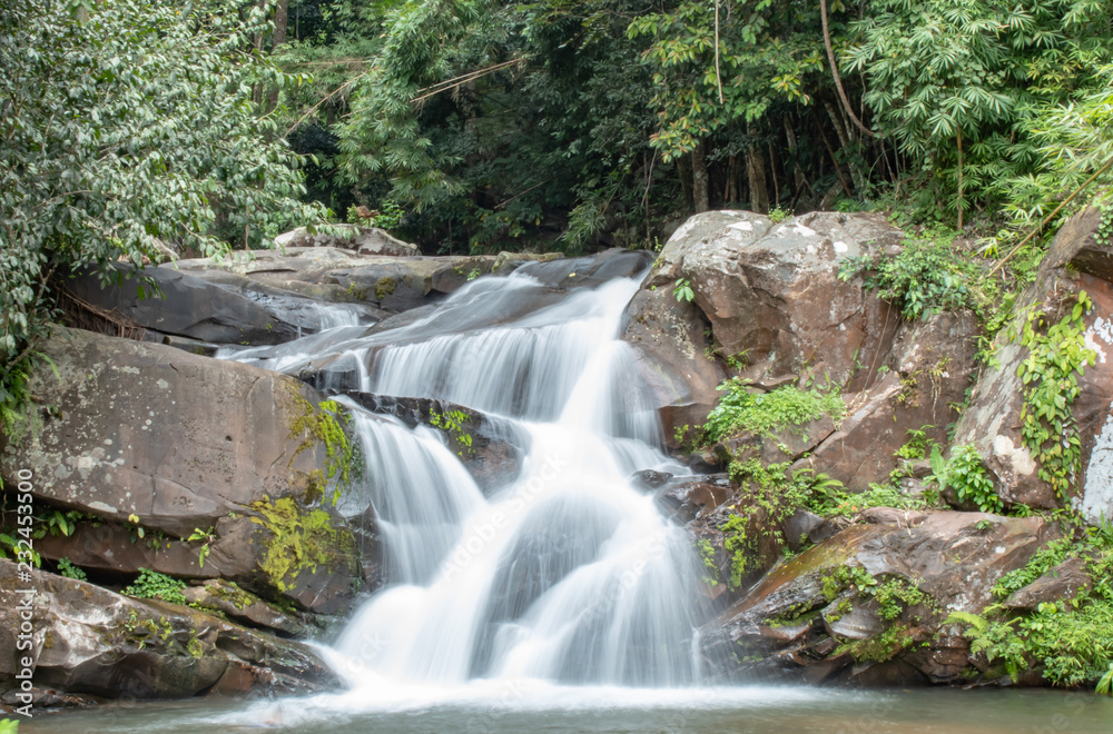 Waterfall flowing from the mountains at Phu SOI DAO waterfall in Loei ,Thailand.