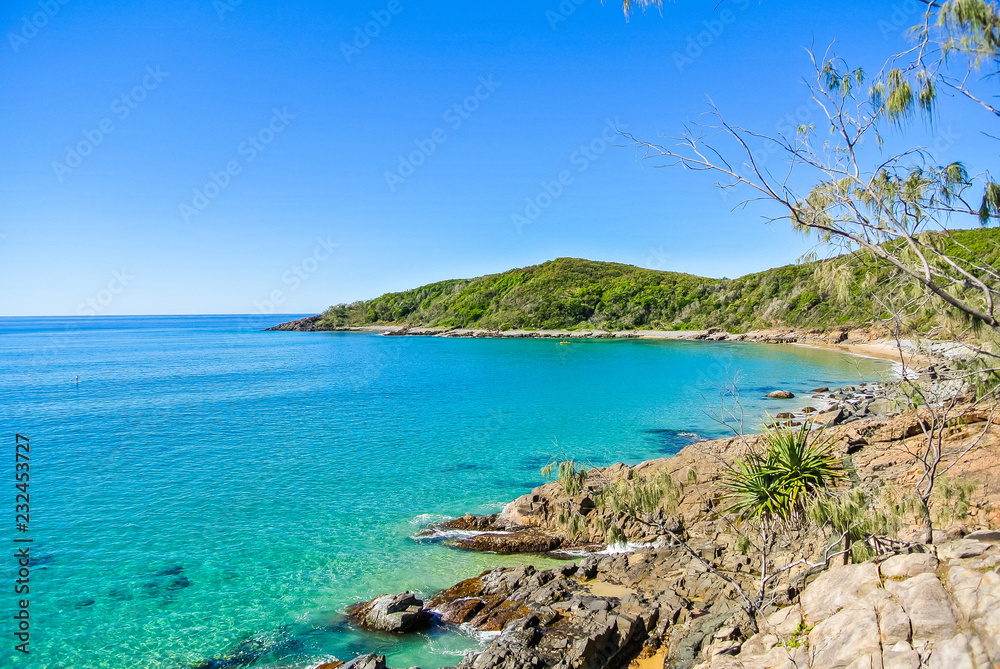 Pristine shoreline with clear blue water at Noosa National Park, Queensland, Australia 