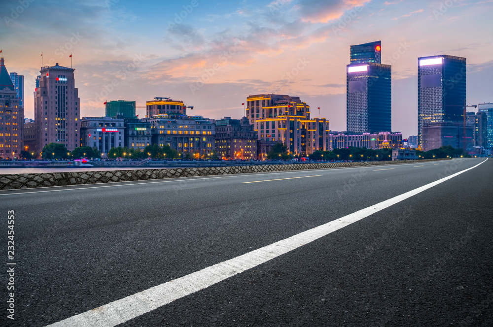 City skyscrapers and road asphalt pavement City skyscrapers and road asphalt pavement