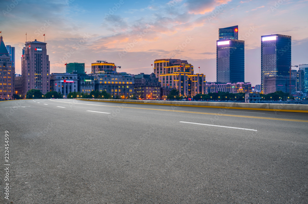 City skyscrapers and road asphalt pavement City skyscrapers and road asphalt pavement