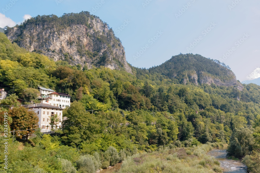 Fototapeta premium Beluno, Italy August 7, 2018: Perarollo di Cadore mountain village. Houses on the mountains.