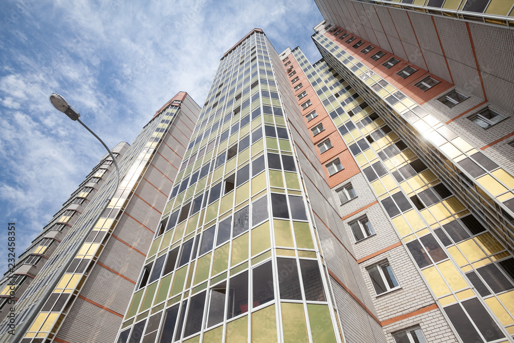 Fototapeta premium bottom view of the facade of a new high-rise building in the new area