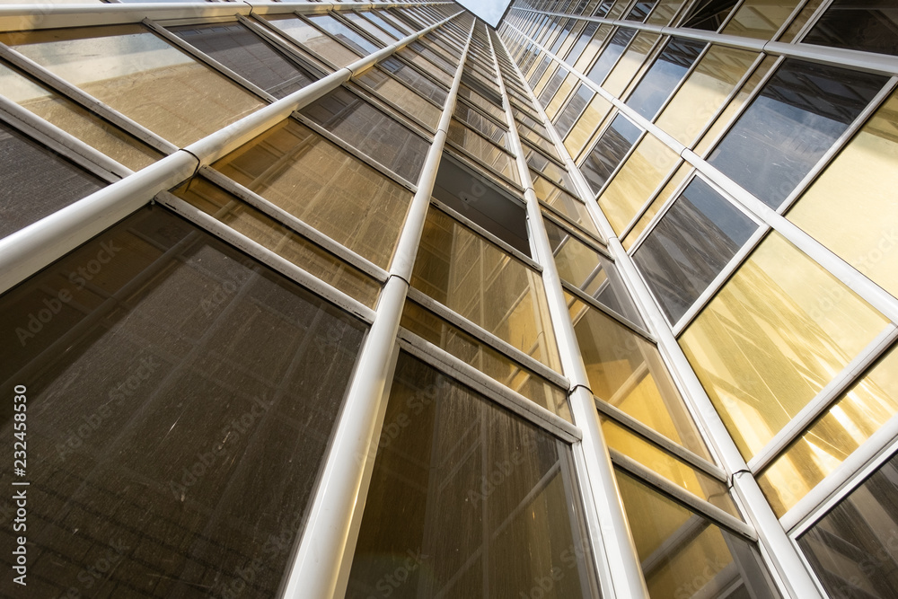 Fototapeta premium bottom view of the facade of a new high-rise building in the new area