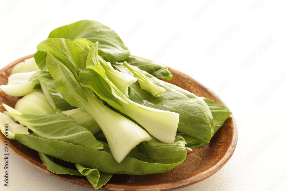 Japanese vegetable, Chigesai chopped on wooden plate Japanese vegetable, Chigesai chopped on wooden plate