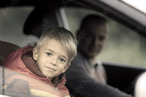 Little boy with dad in the car. photo
