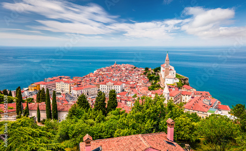 Aerial view of old town Piran. Colorful spring morning on Adriatic Sea. Beautiful cityscape of Slovenia, Europe. Traveling concept background. Magnificent Mediterranean landscape.