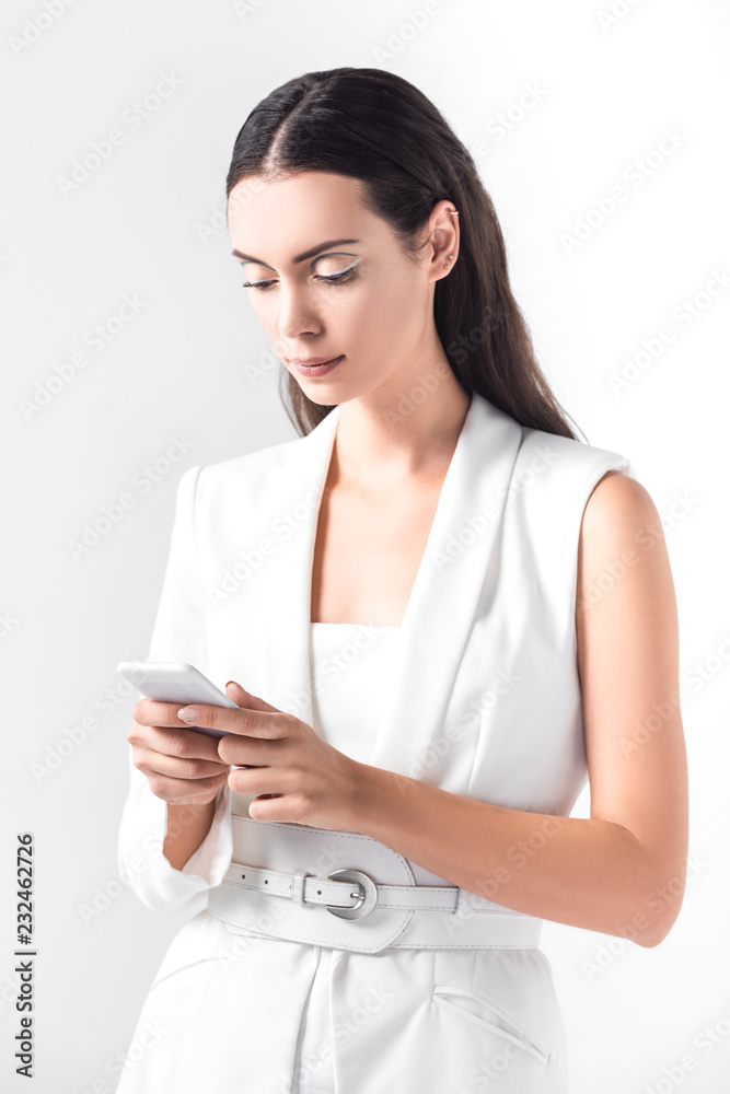 adult beautiful woman using smartphone isolated on white adult beautiful woman using smartphone isolated on white