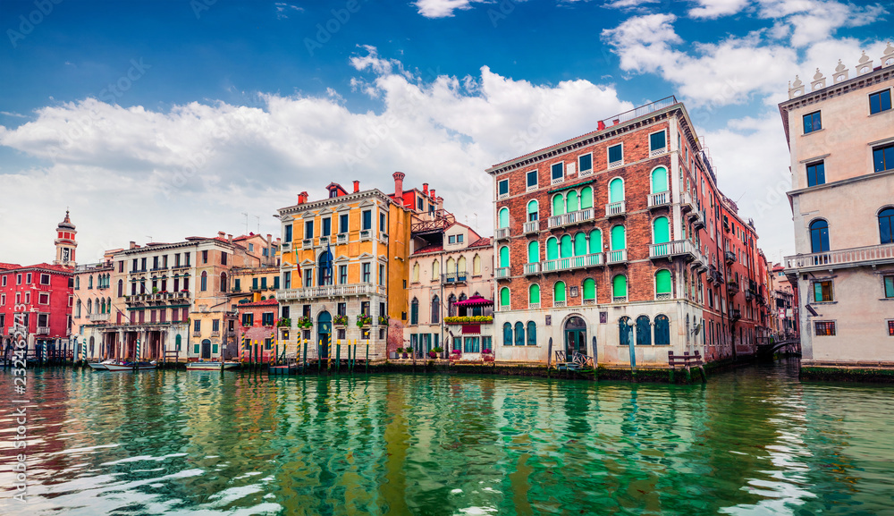 Colorful spring cityscape of Vennice with famous Grand Canal and colorful houses. Splendid morning scene in Italy, Europe. Magnificent Mediterranean cityscape. Traveling concept background.