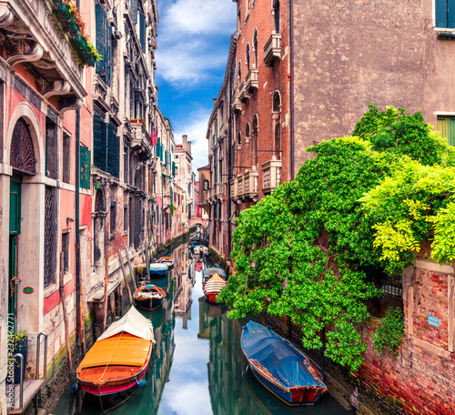 Fototapeta Naklejka Na Ścianę i Meble -  Colorful spring view of Vennice with famous water canal and colorful houses. Splendid morning scene in Italy, Europe. Magnificent Mediterranean cityscape. Traveling concept background.