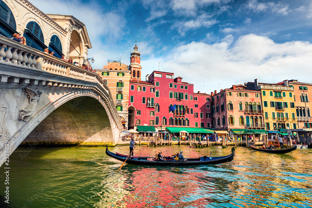 Splendid scene of famous Canal Grande. Colorful spring view of Rialto Bridge. Picturesque morning cityscape of  Venice, Italy, Europe. Traveling concept background.
