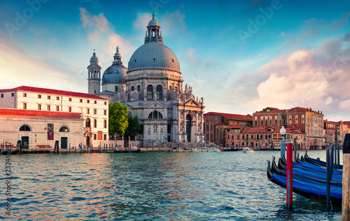 Great evening view of Grand Canal and Santa Maria della Salute Church. Colorful spring sunset in Venice, Italy, Europe. Splendid seascape of Adriatic sea. Traveling concept background.