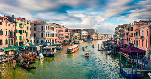 Great scene of famous Canal Grande. Colorful spring view from Rialto Bridge of Venice, Italy, Europe. Picturesque morning seascape of Adriatic Sea. Traveling concept background.
