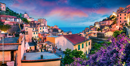 First city of the Cique Terre sequence of hill cities - Riomaggiore. Colorful spring sunset in  Liguria, Italy, Europe. Great evening seascape of Mediterranean sea. Traveling concept background. #232463308