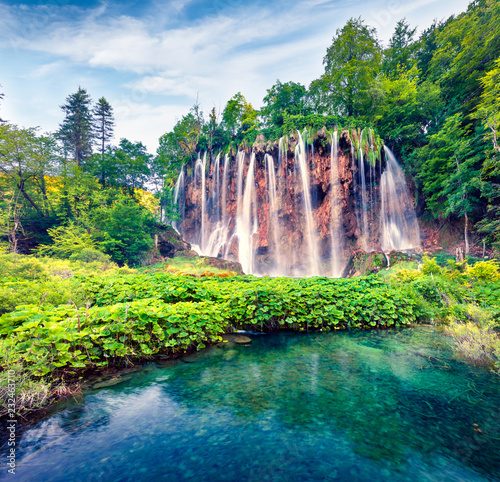 Splendid morning view of Plitvice National Park. Colorful spring scene of green forest with pure water waterfall. Great countryside landscape of Croatia  Europe. Beauty of nature concept background.