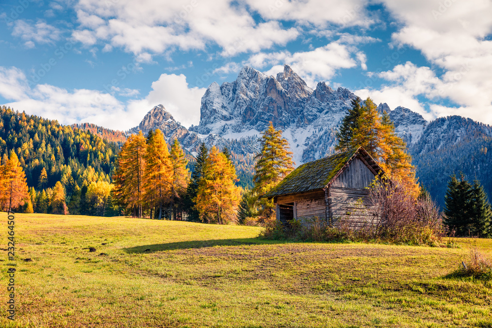 Splendid view of Durrenstein mountain from Vallone village. Colorful autumn scene in the Dolomite Alps, Province of Bolzano - South Tyrol, Itale, Europe. Artistic style post processed photo. Splendid view of Durrenstein mountain from Vallone village. Colorful autumn scene in the Dolomite Alps, Province of Bolzano - South Tyrol, Itale, Europe. Artistic style post processed photo.