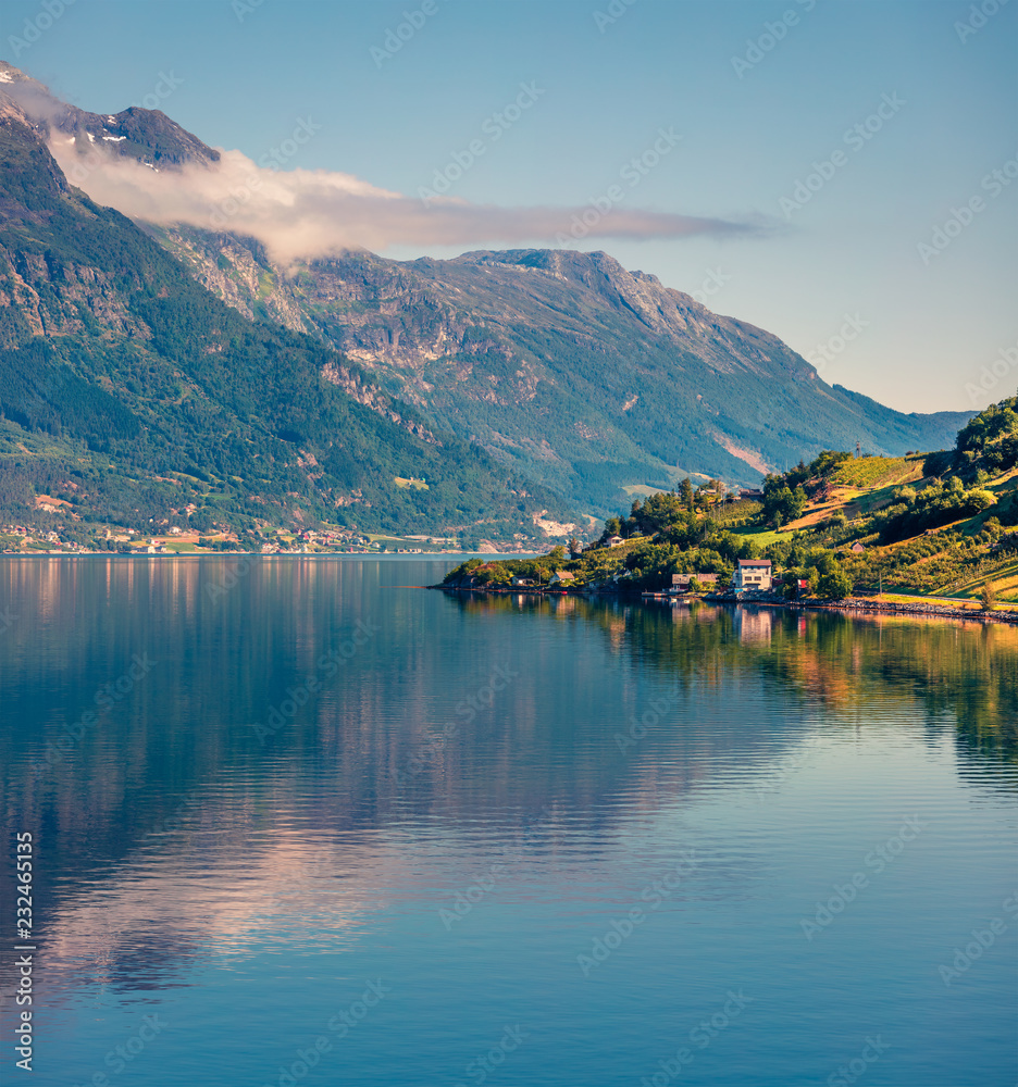 Bright summer morning in Lofthus village in Ullensvang municipality which is located in the Hardanger region of Hordaland county, Norway. Beauty of countryside concept background.