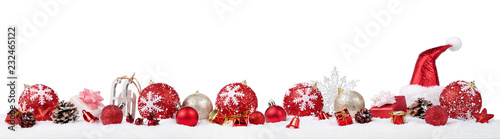 Panoramic christmas ornaments in the snow isolated on white background