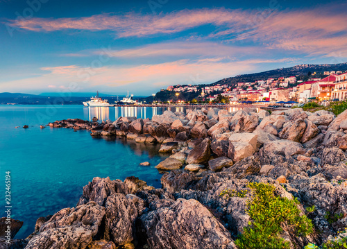 Impressive evening view of Pilos port Colorful spring sunset on the Ionian Sea. Beautiful cityscape scene of Greece city. Traveling concept background. Artistic style post processed photo. photo