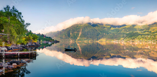 Picturesque summer panorama on the Norwegian fjord, located near Lofthus village in Ullensvang municipality, Hordaland county, Norway. Beauty of countryside concept background.