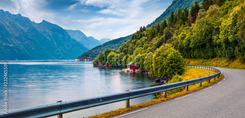 Colorful summer scene of Hjorundfjorden fjord, Orsta municipality, More og Romsdal county. Colorful morning panorama of Norway. Traveling concept background. photo